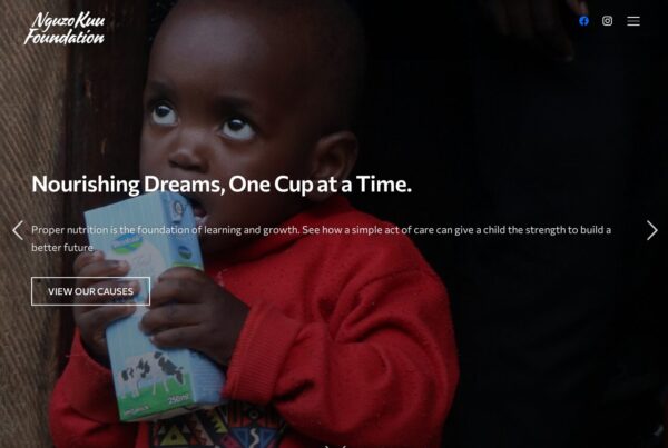Child in red sweater holding milk carton, Neuzkum Foundation website promoting nutrition and child development programs.