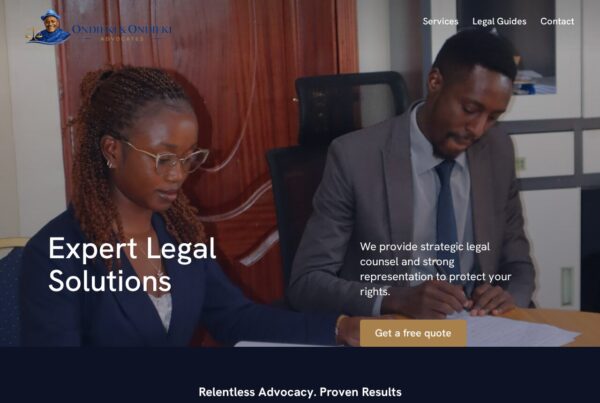 Professional law firm website header showing two attorneys in office working on legal documents with "Expert Legal Solutions" heading.